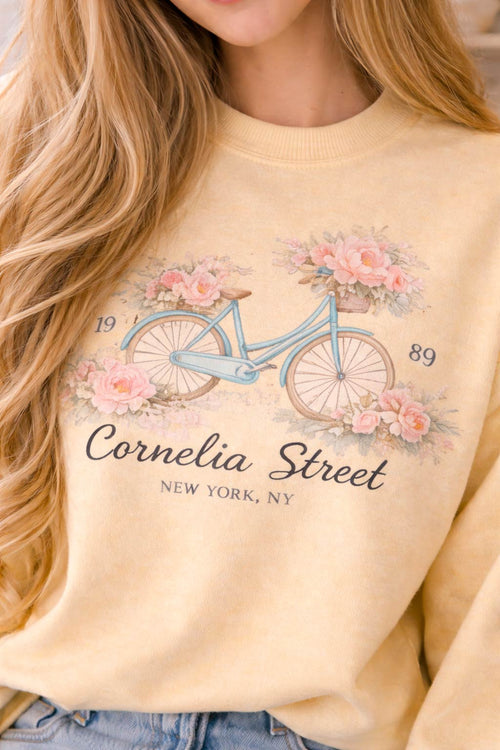Cornelia Street vintage floral bicycle sweatshirt printed on Comfort Colors 1566 butter yellow crewneck worn by model