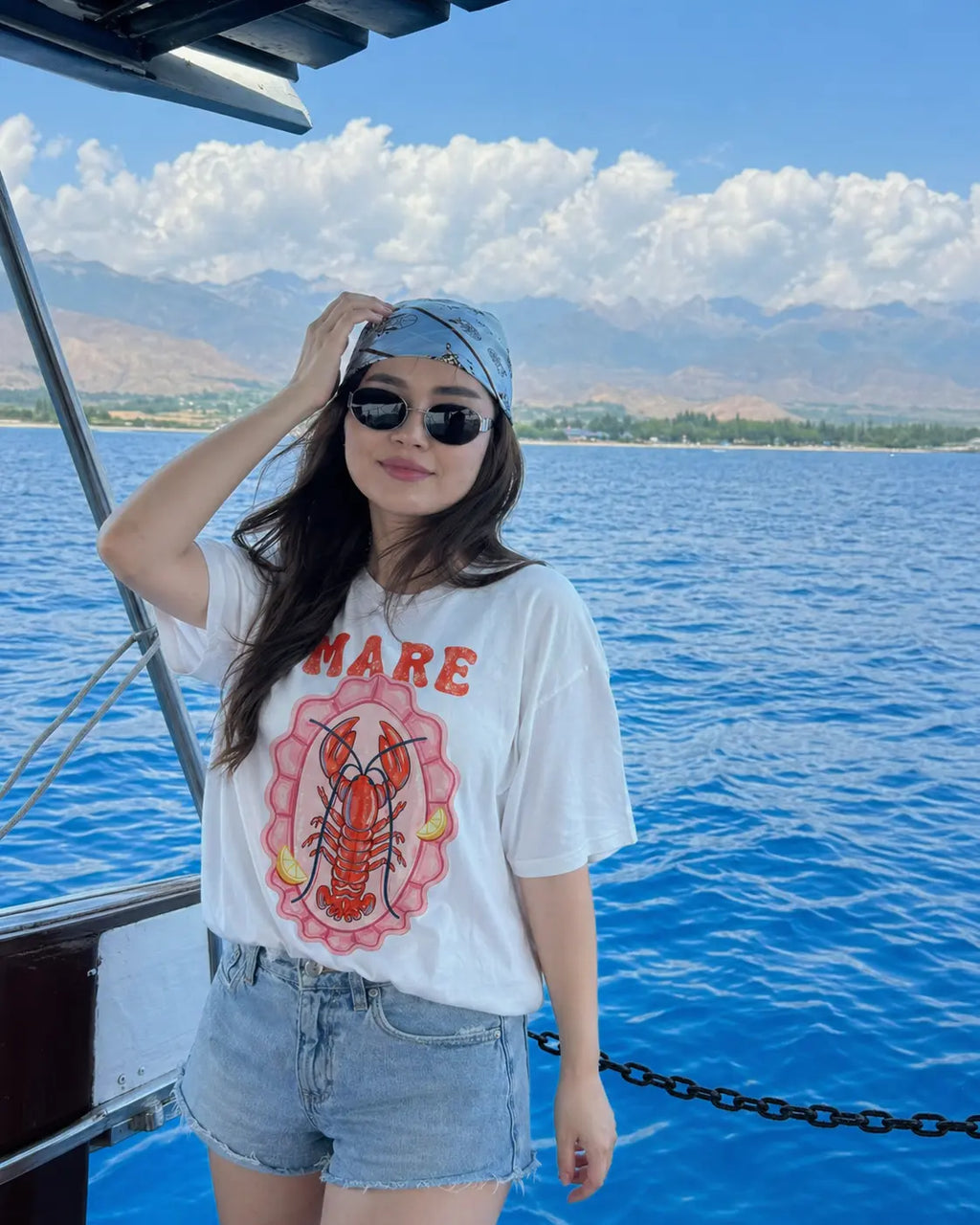 Full look Mare lobster tee women — white vintage coastal graphic shirt with denim shorts and bucket hat