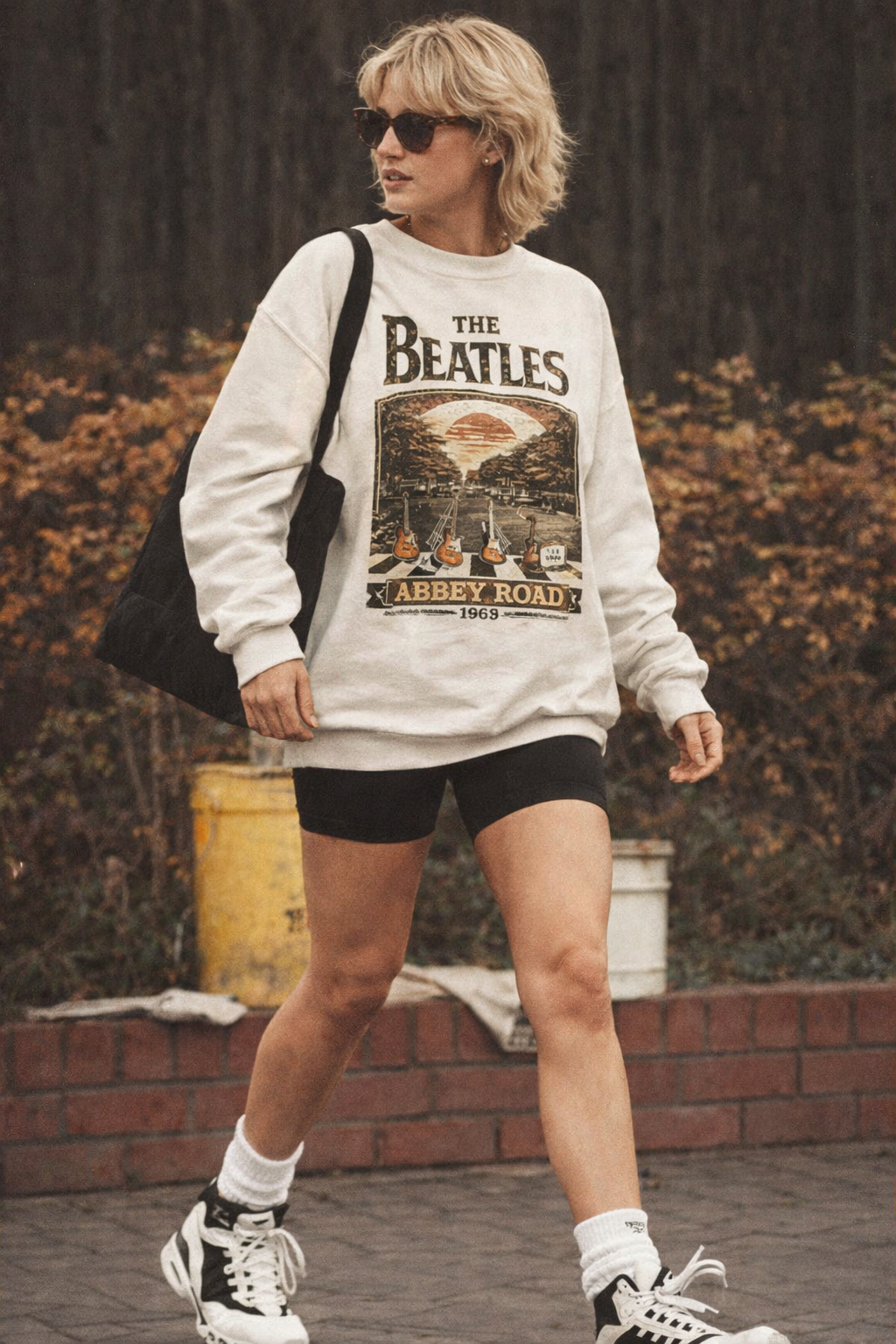 Oversized vintage graphic sweatshirt with retro music design worn by a model

