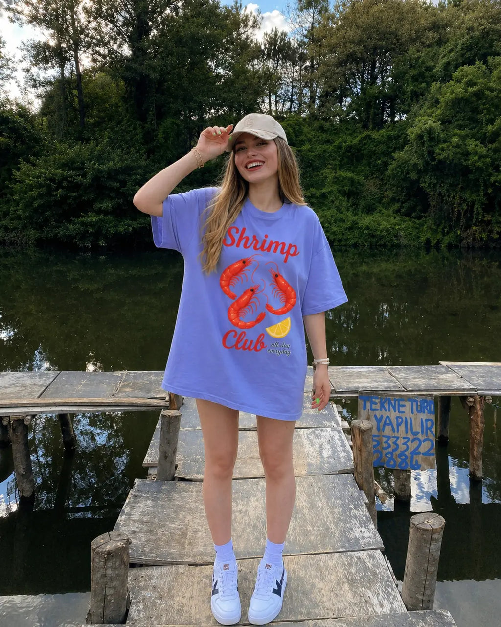 Woman posing in Shrimp Club graphic tee outdoors — vintage coastal t-shirt for seafood lovers S-4XL