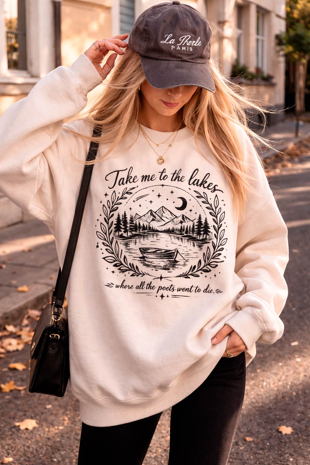 Front view of woman  wearing The Lakes crewneck sweatshirt with vintage outdoor graphic on a Gildan crewneck