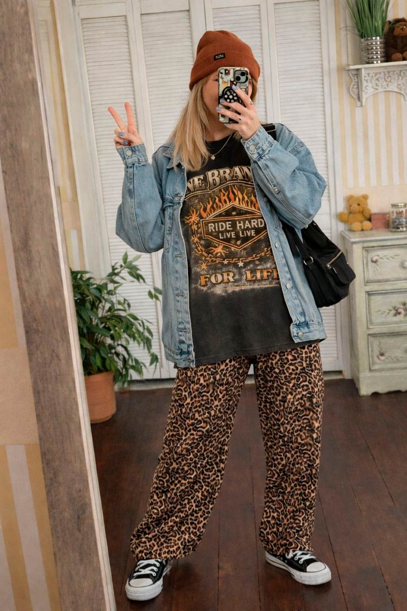 Model wearing vintage motorcycle graphic tee in Comfort Colors Pepper streetwear style
